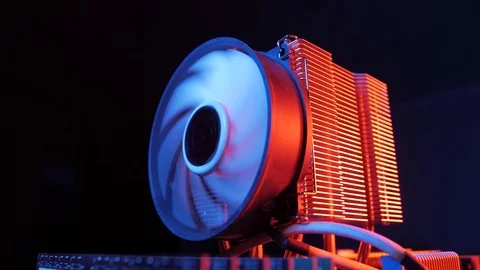 Rotating processor CPU fan installed on the motherboard on a black background Stock Footage 107004307