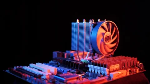 Rotating processor CPU fan installed on the motherboard on a black background Stock-Footage 107004308