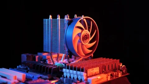 Rotating processor CPU fan installed on the motherboard on a black background Stock Footage 107004317