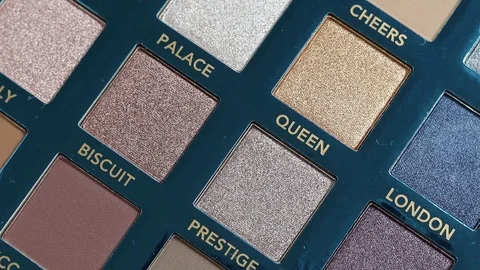 Rotating professional makeup color eyeshadows palette, closeup macro. Stock Footage 127504889