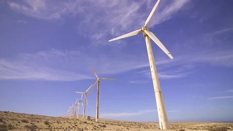 Rotating propellers of wind turbines in the desert Stock Footage 85817772
