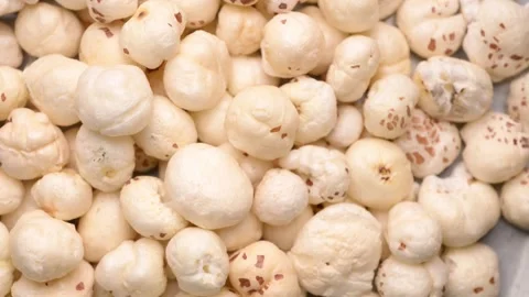 Rotating Puffed Lotus Seeds Overhead Texture Healthy Makhana 4K Video Stock Footage 340754298