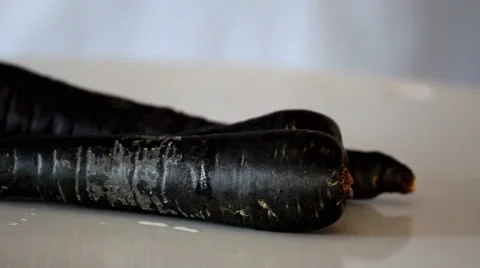 Rotating Purple Carrots with Reflection Stock Footage 2839306