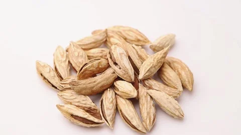 Rotating of raw almond in shell on white background. Stock Footage 133725372