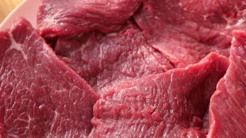 Rotating Raw Beef Slices in Circular Motion, Fresh Red Meat Texture for Butchery Stock Footage 310786503