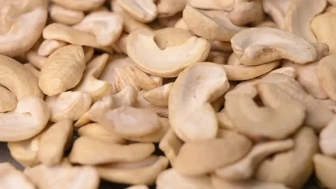 Rotating Raw Cashew Nuts Macro Angled Top View Natural Food 4K Video Stock Footage 340754296