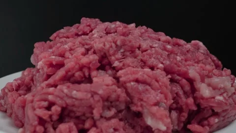 Rotating Raw Ground Beef Meat on Black Background, Closeup Tripod Shot 動画素材 134322888