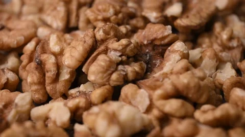 Rotating Raw Walnut Kernels Macro Angled Top View Healthy Food 4K Video Stock Footage 340752548