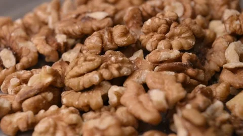 Rotating Raw Walnut Kernels Macro Angled Top View Healthy Food 4K Video Stock Footage 340752553