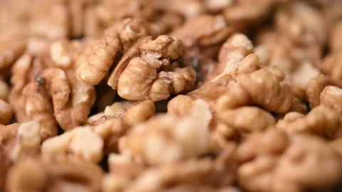 Rotating Raw Walnut Kernels Macro Angled Top View Healthy Food 4K Video Stock Footage 340753795