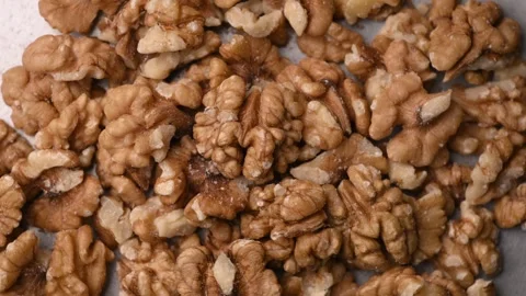 Rotating Raw Walnut Kernels Top View Healthy Nut Texture Macro 4K Video Stock Footage 340747133