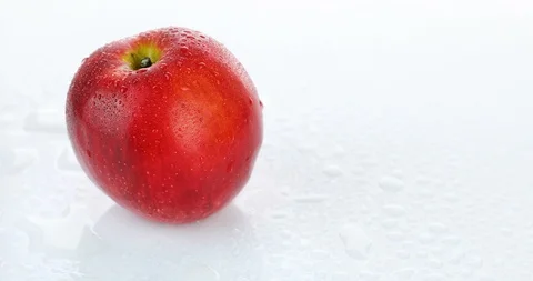 Rotating red apple on white background Stock Footage 102257054