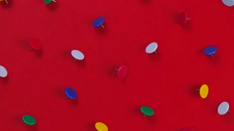 Rotating red background with pushpins ort humbtack Stock Footage 196827160