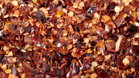 Rotating red chili flakes, close-up Stock Footage 157988880