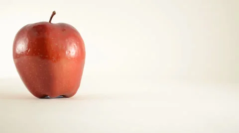 Rotating Red Delicious Apple Against White - Dolly Right Stock Footage 24471115