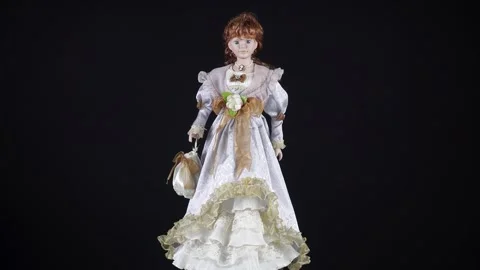 Rotating Red-Haired Doll In A Beautiful Dress. Stock Footage 290392135