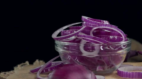Rotating Red Onion Rings (not loopable, 4K) Video stock 58848555