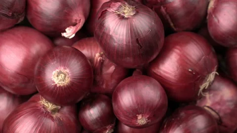 Rotating red onions background Stock Footage 98061970