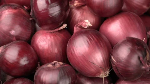 Rotating red onions background Stock Footage