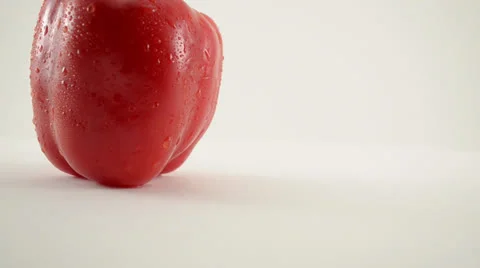 Rotating Red Pepper Against White - Crane Up Stock Footage 22648725