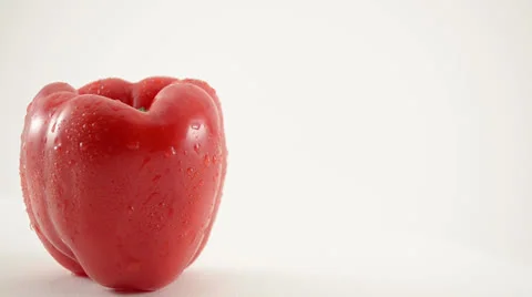 Rotating Red Pepper Against White - Crane Down Video stock 22648755