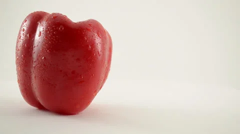 Rotating Red Pepper Against White Stock Footage 22648770