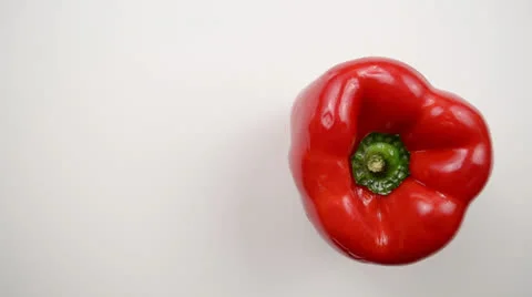 Rotating Red Pepper Against White - Overhead Dolly Left Stock Footage 22803442