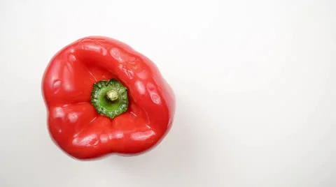 Rotating Red Pepper Against White - Overhead Dolly Right Video stock 22803460