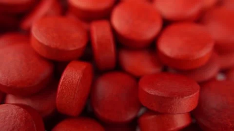 Rotating red pills. Selective focus, macro shot, shallow depth of field 库存影片 139445626