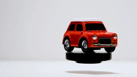 Rotating Red Toy car on a white background. Stock Footage 116439918