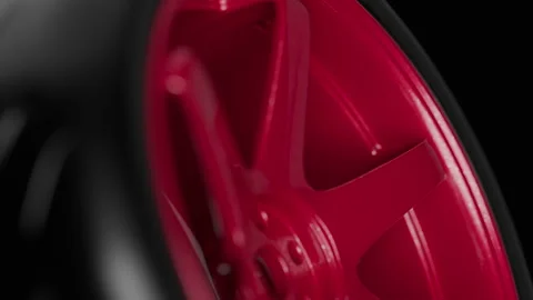 Rotating red wheel showcase sleek design and modern craftsmanship in motion Stock Footage 322544305