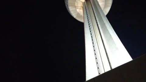 Rotating Restaurant Tower At Night Lit Up Upward Pan Stock Footage 247008960