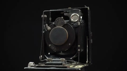 Rotating Retro Camera On A Black Background. Video stock 246531373