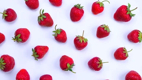 Rotating ripe strawberries on a white background, trendy, bright, summer Stock Footage 196968972