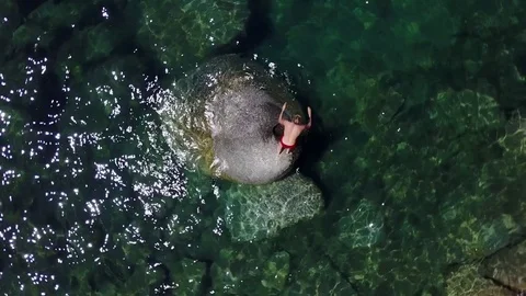 Rotating Rising Shot Over Guy Jumping Into Lake Tahoe Stock Footage 81010009