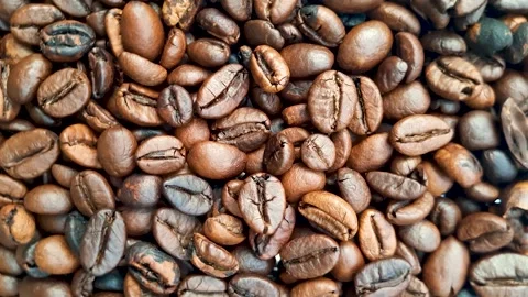 Rotating roasted brown coffee beans. Stock Footage 253249060