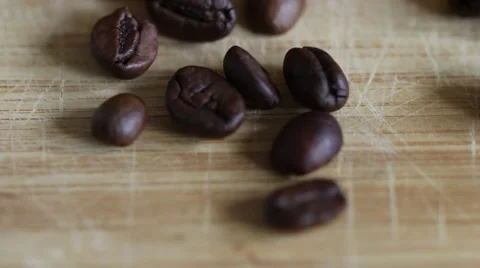 Rotating roasted coffee beans background concept on desk Stock Footage 68398583