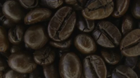 Rotating Roasted Coffee Beans Macro Food Texture. 스톡 동영상 334575472