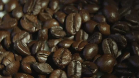 Rotating Roasted Coffee Beans Top View Macro Background. 스톡 동영상 334324768