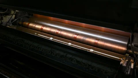 Rotating roller of industrial printer in production workshop Stock Footage 249881472