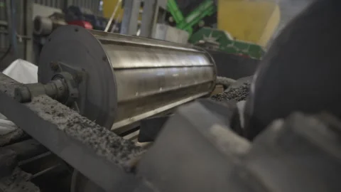 Rotating rollers crush rubber batches with precise force Stock Footage 314643439