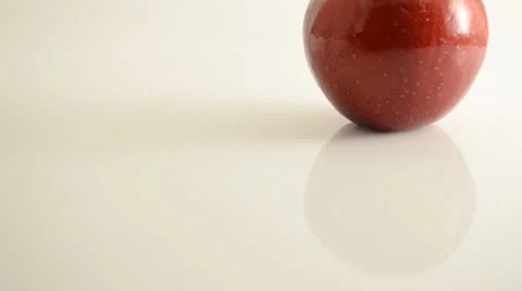 Rotating Rome Apple On Acrylic Against White - Crane Up Stock Footage 24470187