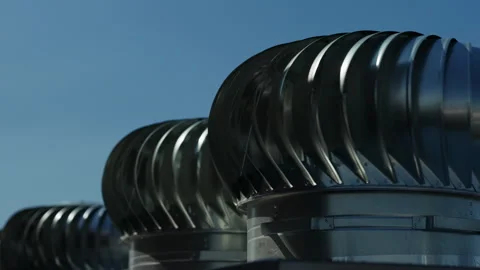 Rotating rooftop turbine ventilators providing natural air exhaust Stock Footage 346550757