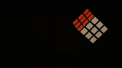 A rotating Rubik´s cube isolated on a black background Stock Footage 60672127