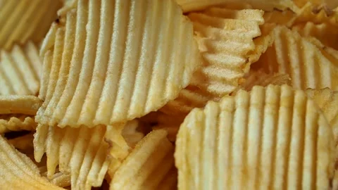 Rotating ruffled potato chips, close-up Stock Footage 157988897