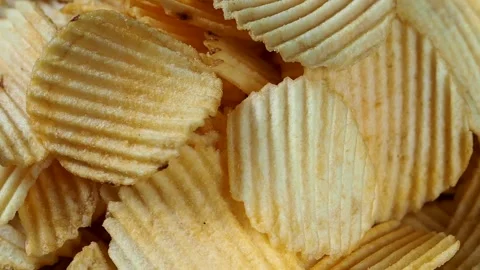 Rotating ruffled potato chips, close-up Stock Footage 157988902