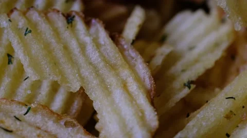 Rotating ruffled potato chips with dill. close-up. selective focus. Stock-Footage 218317813