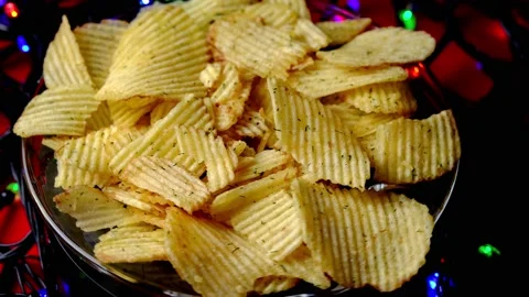Rotating ruffled potato chips with dill. close-up. selective focus. Stock Footage 218317884