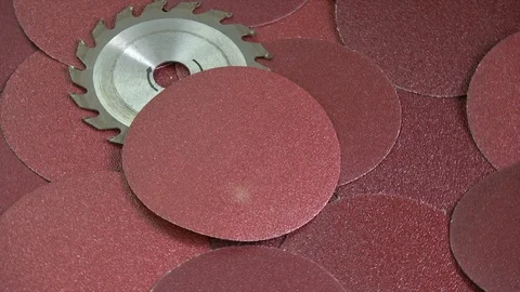 Rotating sanding discs and circular saw tool Stock Footage 95057656