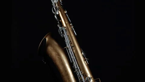 Rotating Saxophone On A Black Background. Stock Footage 143979429